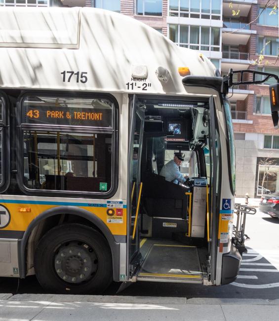 43 bus with driver deploying ramp